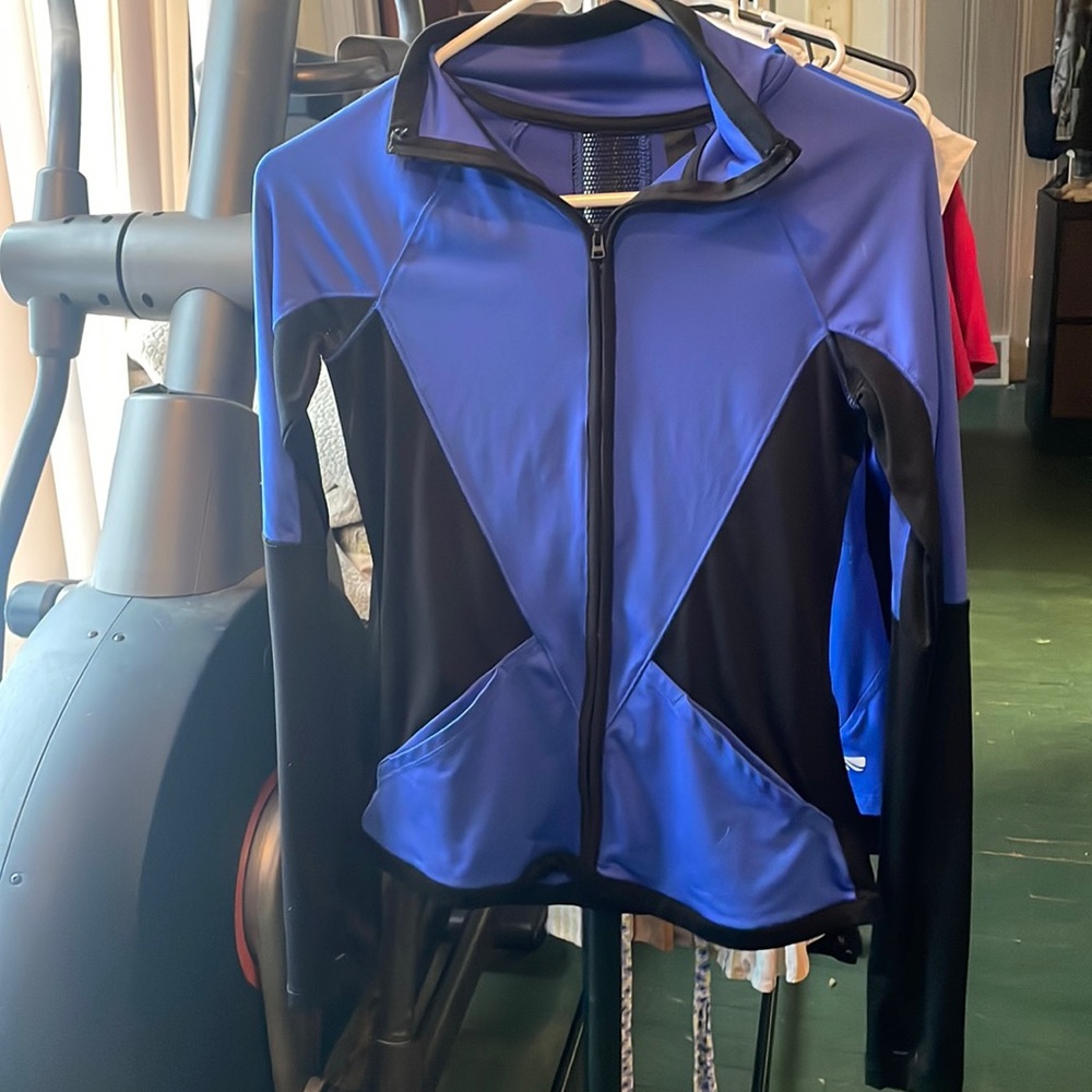 No hood, zip up, lightweight.
